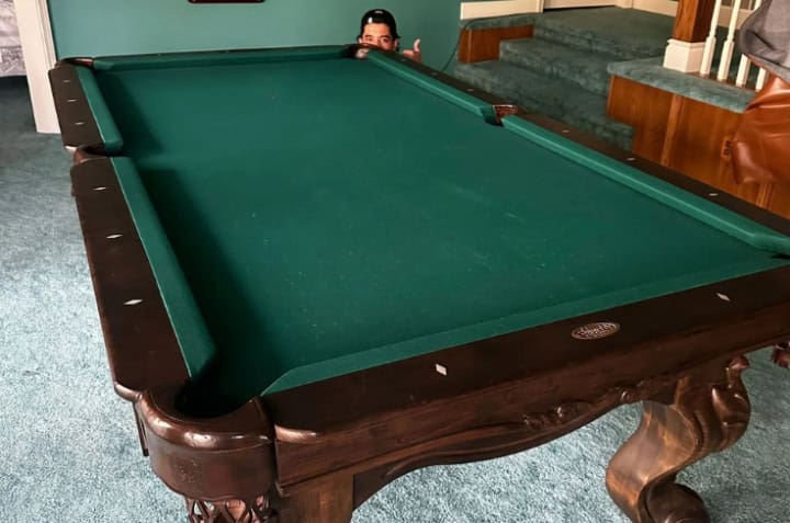 Pantheon Moving crew moving a pool table in Kansas City