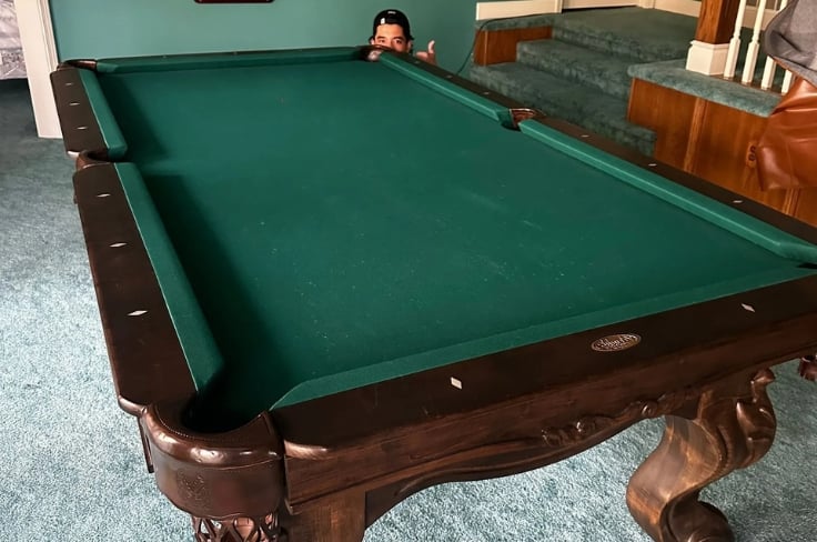 Pantheon Moving crew moving a pool table in Kansas City
