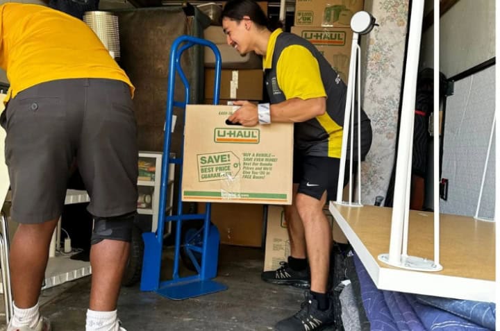 Pantheon Moving crew member patiently assisting a senior client in Kansas City