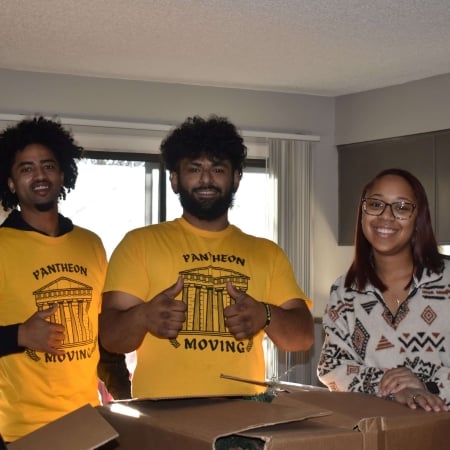 Pantheon Moving crew members smiling after completing a successful Kansas City move