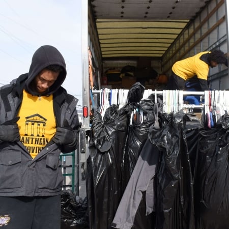 Furniture wrapped in blue protective covering by Pantheon Moving crew in Kansas City